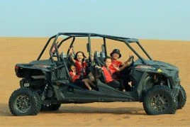 Family Riding Black Dune Buggy