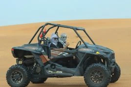 Two People Riding Dune Buggy